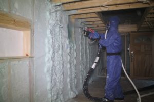 Alan installing foam insulation