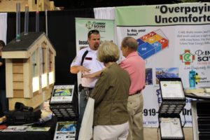 Corey Yates at the New Orleans Home and Garden Show explaining energy efficiency