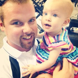 Corey Yate, owner of Sunlight Contractors, and his baby daughter Mckenzie