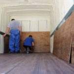 Sunlight Contractors New Orleans Licensed contractors installing spray foam insulation Reinstalling paneling over spray foam insulation