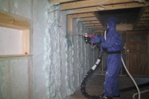 Sunlight Contractors installing spray foam insulation in a newly built home.