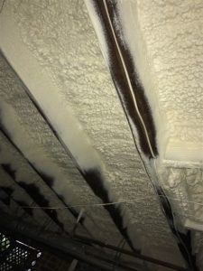 Subfloor of Building with closed cell spray foam insulation at night 2