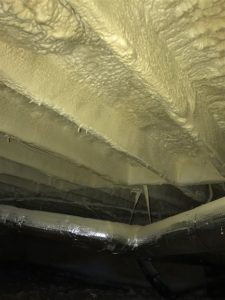Subfloor of Building with closed cell spray foam insulation at night 5