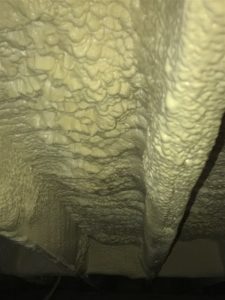 Subfloor of Building with closed cell spray foam insulation at night 8