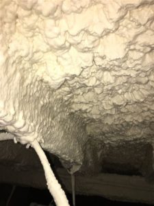 Subfloor of Building with closed cell spray foam insulation at night 30