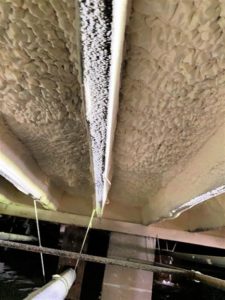 Subfloor of Building with closed cell spray foam insulation at night 34