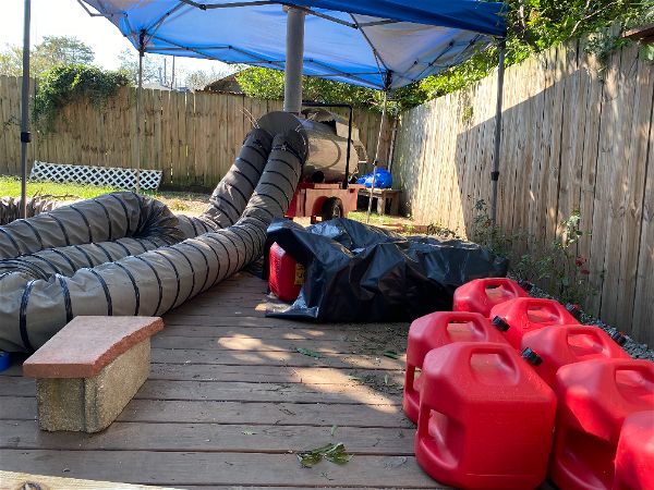 Equipment setup for crawlspace repair with spray foam insulation