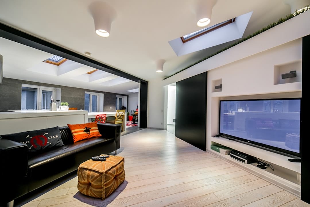 Modern, well-insulated home, possibly with a visible energy efficiency symbol or low utility bill.