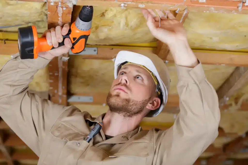 Man drives screws into ceiling 1767019676391